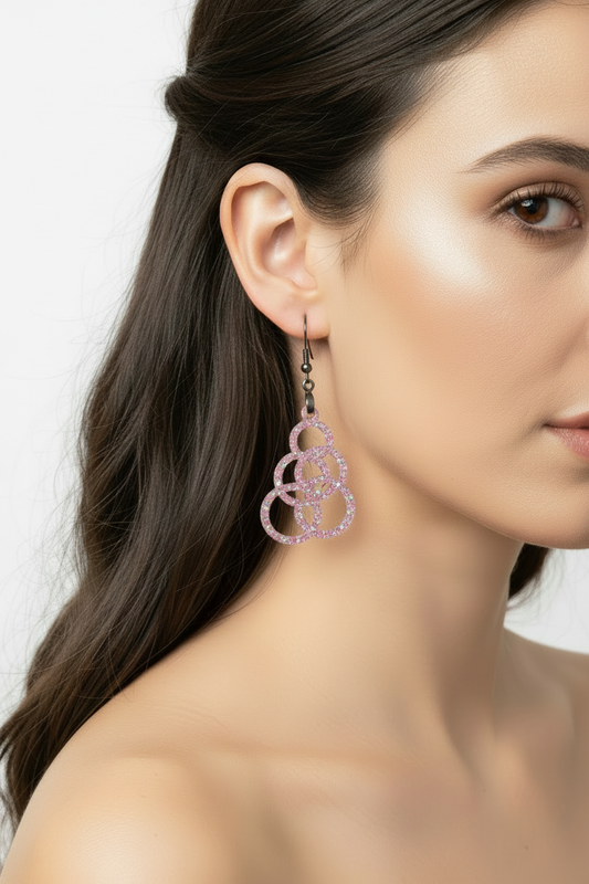 Pink glitter trefoil earrings on model - smaller again